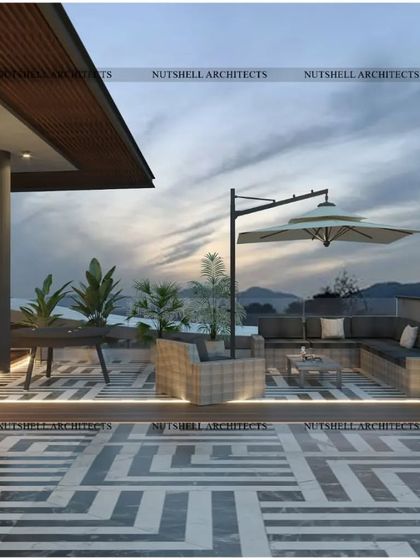 We designed this rooftop terrace for easy lounging with panoramic views. The space includes comfortable, all-weather sectional seating and a large umbrella for shade, all set upon a striking geometric-patterned floor.