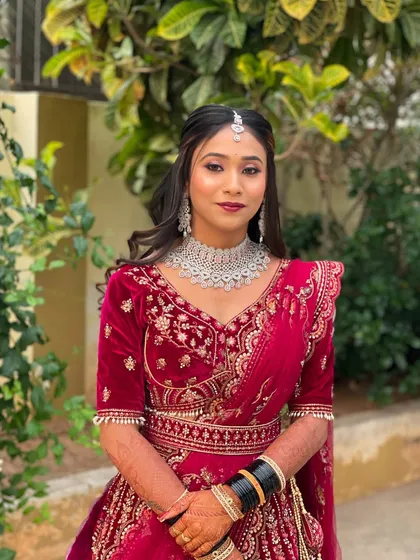 The bride looking radiant and ready for her reception party.