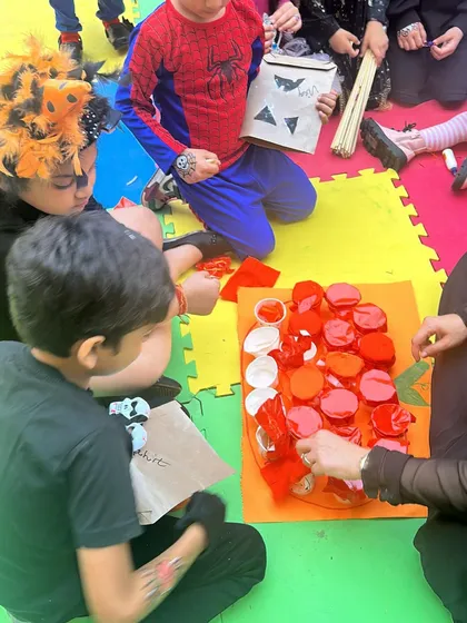 Our Halloween Fiesta was a spooktacular success. Kids dressed up in their favorite costumes, like Spider-Man, and worked together on fun, spooky-themed group craft projects.