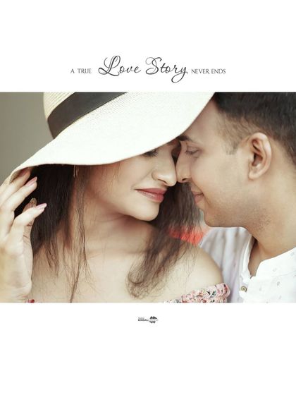 A beautiful close-up shot with the quote "A True Love Story Never Ends." The wide-brimmed hat adds a touch of chic, summery style to this romantic portrait.