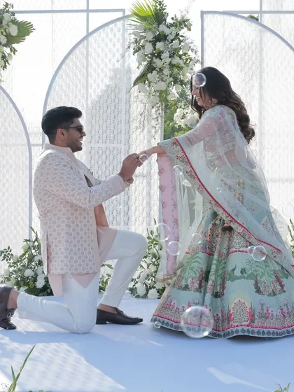 The proposal moment during the ring ceremony, made even more magical with bubbles floating around the couple.