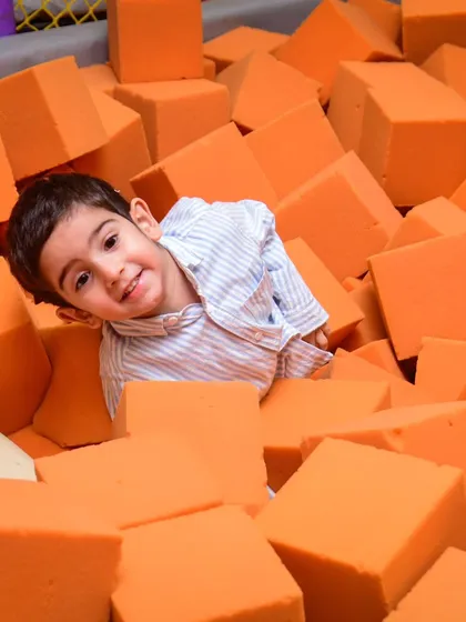 Peek-a-boo from the foam pit! It's always fun to see where the kids will pop up next.