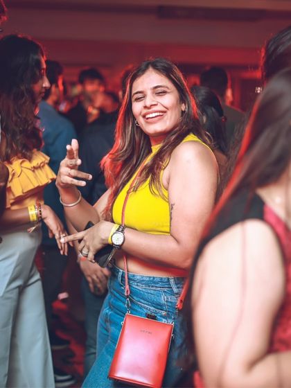 A smiling guest enjoying the party atmosphere. My goal is to make sure every person in the room feels the positive energy.