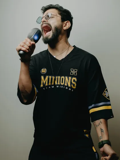 Rocking a 'Minions' jersey and singing my heart out. A fun, casual look for a themed party.