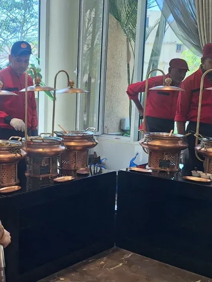 A glimpse of our buffet setup for a Janyu event. I use these traditional copper and brass chafing dishes not just for their looks, but because they maintain the food's temperature and purity, which is essential for religious ceremonies.
