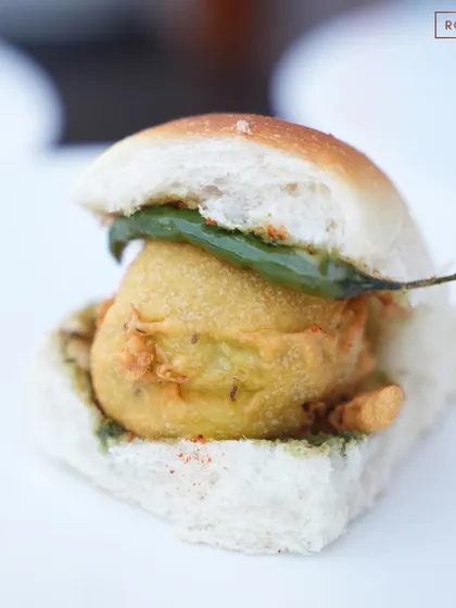 The iconic Vada Pav, served with a modern twist during our Indian Street Food celebration. A crispy potato fritter in a soft pav, it's a taste of Mumbai in Delhi.