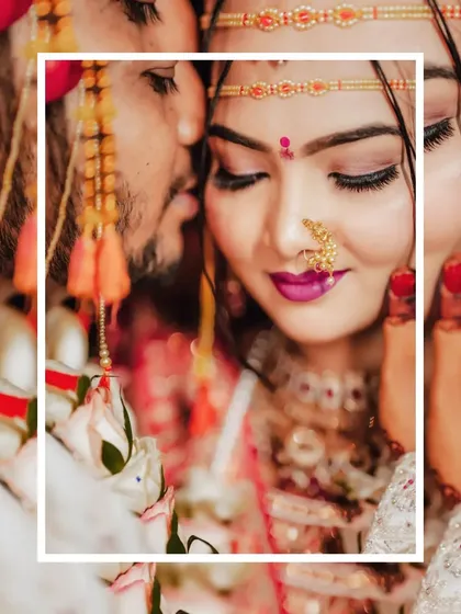 A beautifully framed close-up of the bride, capturing a quiet, emotional moment with her eyes closed.