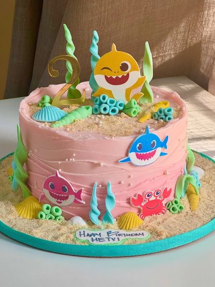 Another take on the adorable Baby Shark theme, this cake is ready to make waves at a birthday party. It features vibrant ocean elements and playful details perfect for a young fan.