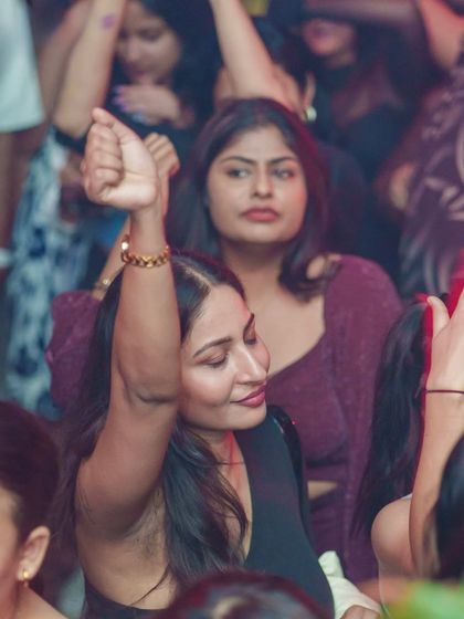 The crowd is completely absorbed in the music and the moment.