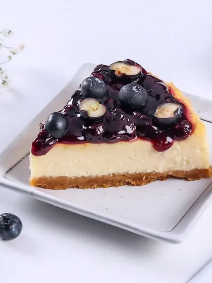 Here is a slice of my Blueberry Cheesecake. The tartness of the blueberry compote cuts through the richness of the creamy cheesecake beautifully.