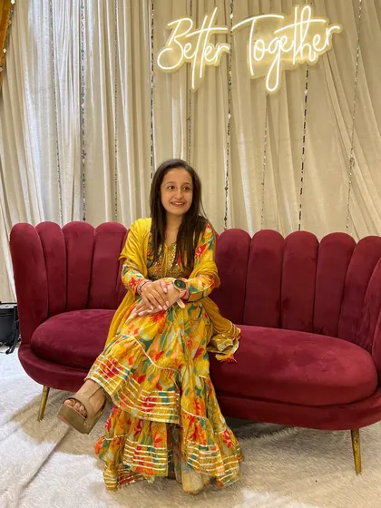 A candid moment sitting at the wedding event. The decor, the lights, the happiness, it's all part of the beautiful experience.