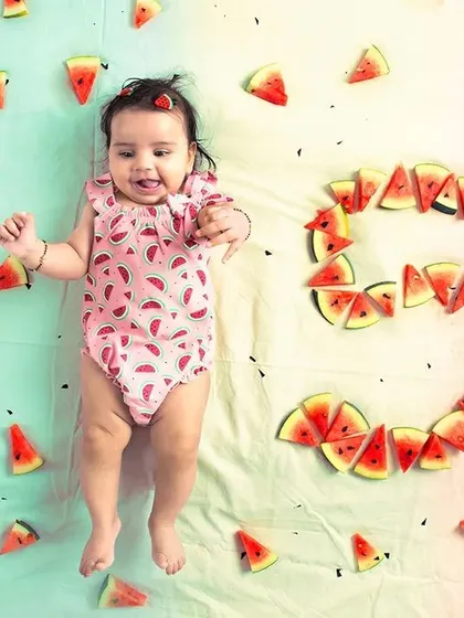 My studio offers plenty of floor space for creative setups like this milestone baby photoshoot. This top-down shot was easily achieved, and the dual-tone backdrop shows how you can combine different colored paper rolls for a unique look.