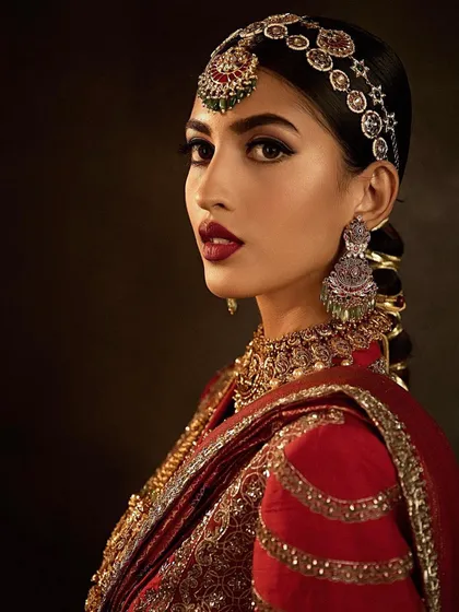 A bold and dramatic bridal look from the Delhi Masterclass. Students learned how to create a statement red lip and a defined eye.