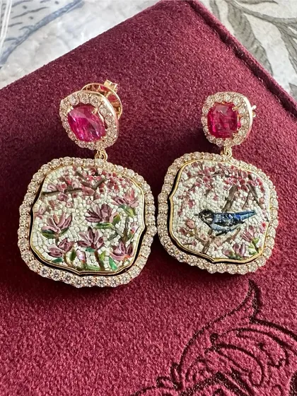 My Cherry Blossom earrings, featuring a delicate bluebird on one side. This pair is handcrafted with natural Mozambique rubies and diamonds, set in 18k gold.