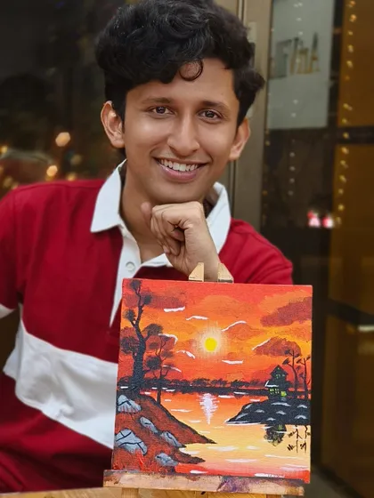 The smile says it all. A participant proudly shows off the sunset landscape he painted during our weekend workshop. No prior experience is needed to join and have a great time.