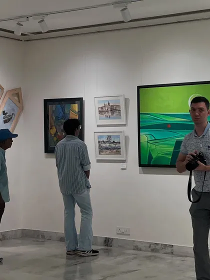 Visitors admiring the artworks at the "Russia, an Indian View II" exhibition. It's always a pleasure to see people engage with the art.