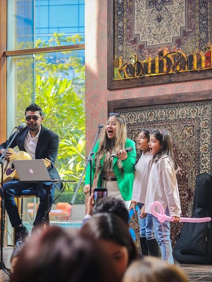 Live music is a key part of the brunch experience for all ages. Here, our performers even invite some aspiring young singers to join them on stage, creating a truly interactive and memorable show for the whole family.