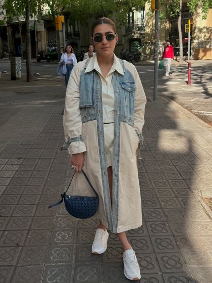 A trench coat is a travel essential. This one has cool denim details, making it a unique layering piece over a simple co-ord set.