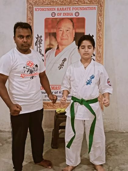 This student has worked hard to earn his green belt. His stance is already showing more confidence.