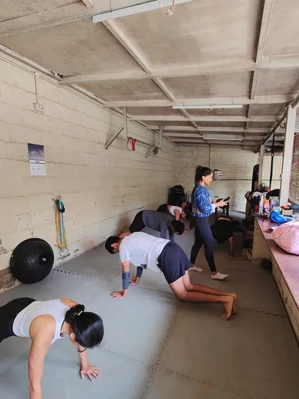 Our classes often end with a tough conditioning circuit. Here, members are working through planks and other core exercises.
