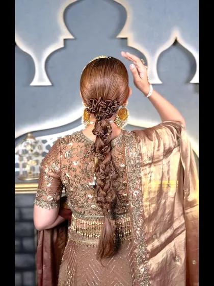 Here you can see the full length of the textured braid. This style is perfect for a bride who wants something unique and detailed for her wedding or reception look.