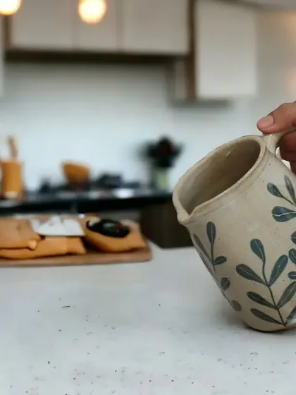 I love seeing my pieces in their new homes. This handmade ceramic jug with a leaf motif is perfect for everyday use, adding a touch of elegance to the kitchen.