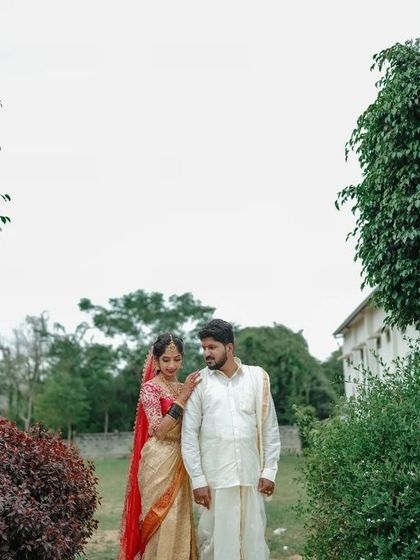 A serene portrait of a couple in a garden setting after their wedding. We find beautiful, quiet spots for your first portraits as a married couple.