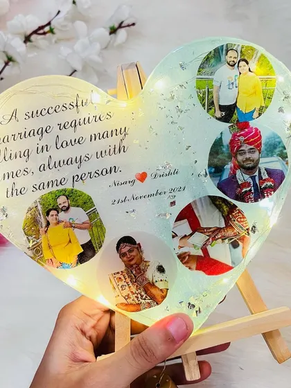 This 8-inch heart frame is a lovely gift. It features a collage of photos and a heartfelt quote, all illuminated by warm fairy lights.