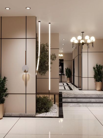 This view shows the flow of the lobby space, with clean lines and potted plants guiding the eye. The design ensures easy movement for large groups while maintaining a sense of modern elegance.