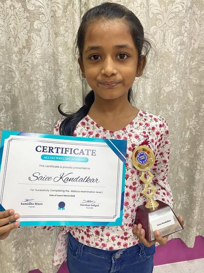 Saiee Kandalkar with her certificate and trophy for successfully completing the Abacus 1st level examination.