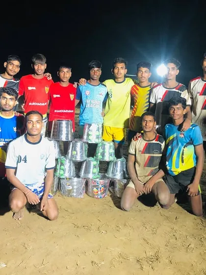 Our team with their prize buckets after winning the Aligarh 'gol' kabaddi tournament.