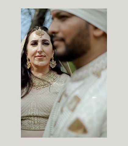 A beautiful, soft-focus portrait of the couple. The artistic blur and their gentle expressions create a dreamy and romantic mood.
