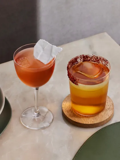 Two of our signature brunch cocktails, side by side. On the left, the Slow Love, and on the right, the Sombrero, showcasing the range of our creative mixology.