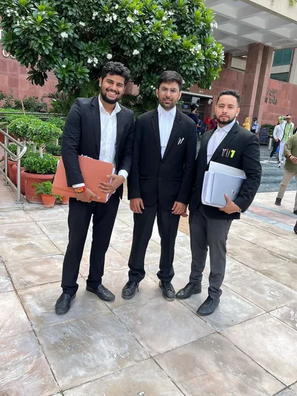 With colleagues at the Delhi High Court, holding case files and ready for the next challenge. This is the daily life of a litigation lawyer.