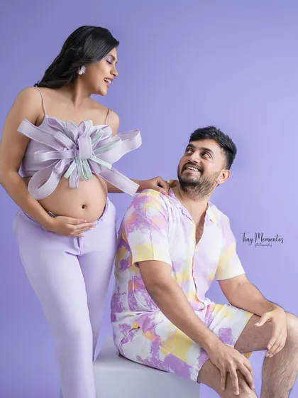 For the fashion-forward couple, this playful and stylish shot with coordinated pastel outfits makes for a fun and unique maternity portrait.