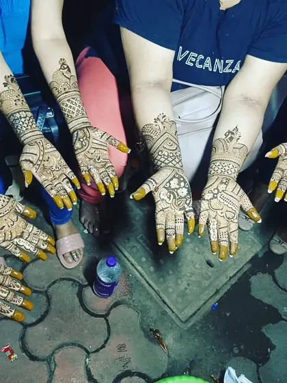 Another shot of a group mehendi session. You can see the fresh henna paste, which will dry and leave a beautiful dark stain.