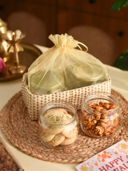My Desi Dazzle Basket, a simple yet elegant gift containing jars of Spicy Masala Cashews and Almond Pista Cookies.