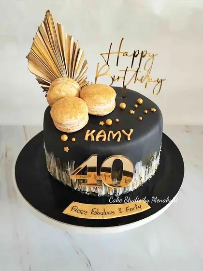 This cake proves that milestone birthdays can be both fierce and fabulous. For this 40th birthday, I used a striking black and gold theme, complete with macarons and a custom topper, for a truly sophisticated celebration.