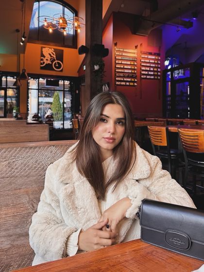 A posed shot inside the restaurant, looking at the camera, perfect for a lifestyle or dining feature.