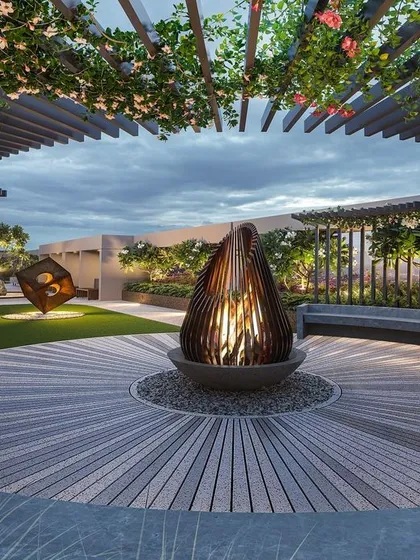 This 3D concept shows a captivating gathering space on a terrace. A circular concrete bench envelops a central fire pit, all under a trellis designed for bougainvillea to create a flowering canopy.