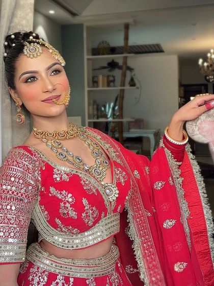 An extensive series of our classic red bridal lehenga. These images capture every detail, from the embroidery to the full bridal styling, providing a complete reference.