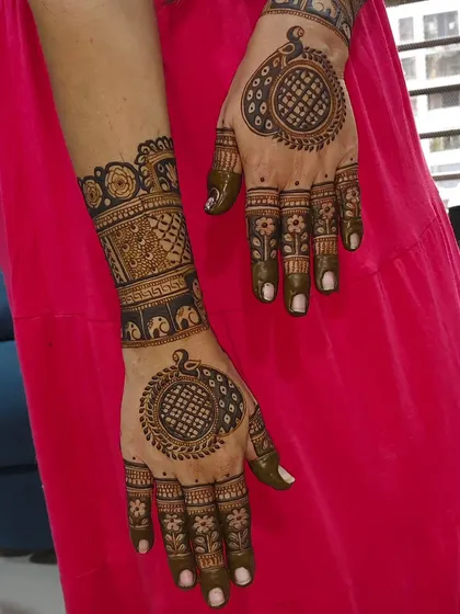 A matching set of hand and foot mehendi, featuring mandala designs for a coordinated look.
