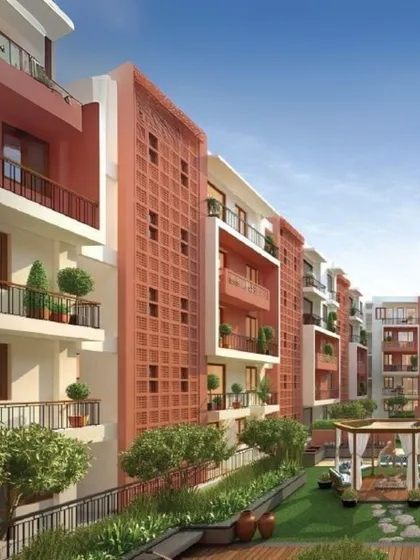 The facade at Utopia features terracotta jali screens, a nod to traditional materials that also provides passive cooling. The low-rise blocks are wrapped around shared open spaces, fostering a sense of community.