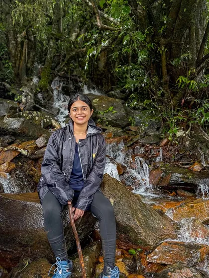 A trekker taking a break by a small stream on the way to Kudremukha peak. The journey is just as beautiful as the destination.
