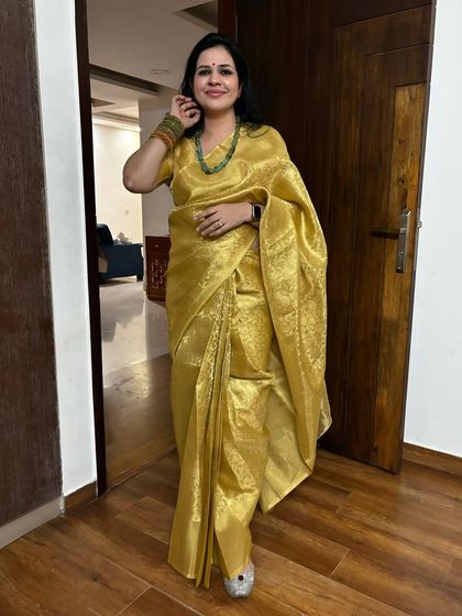 This golden saree is another one of my festive favorites. Paired with a green beaded necklace, it creates a beautiful contrast.