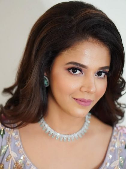 A simple, elegant portrait of Nilofar. Her makeup is polished and refined, with a hint of color on the eyes to make them pop.