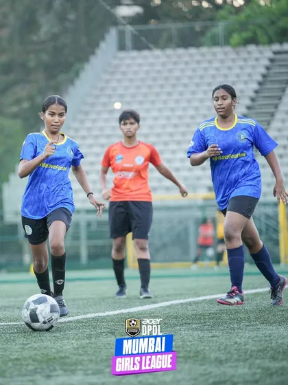 Two of our female players work in tandem during a match, one dribbling forward while her teammate provides support. This shows the teamwork and tactical awareness we instill in our girls' teams.