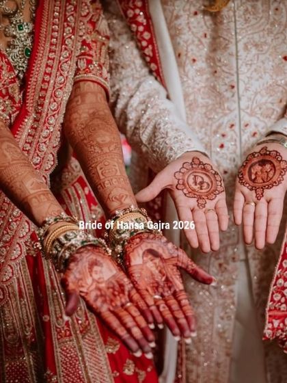 The groom's mehendi is part of the story too. Here, the bride's hands feature intricate patterns, while the groom's palms hold a custom monogram and a small Ganesha motif for blessings.