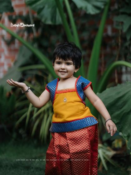 Adorable overload alert. This little one is posing like a star in her beautiful ethnic wear.