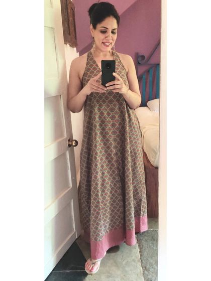 This printed cotton halter dress is a travel essential for me. It's comfortable, stylish, and perfect for a relaxed evening in Goa.